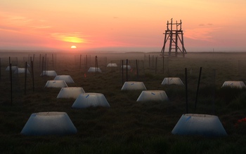 Environmental chambers in early morning light in the Yukon-Kuskokwim Delta in western Alaska.